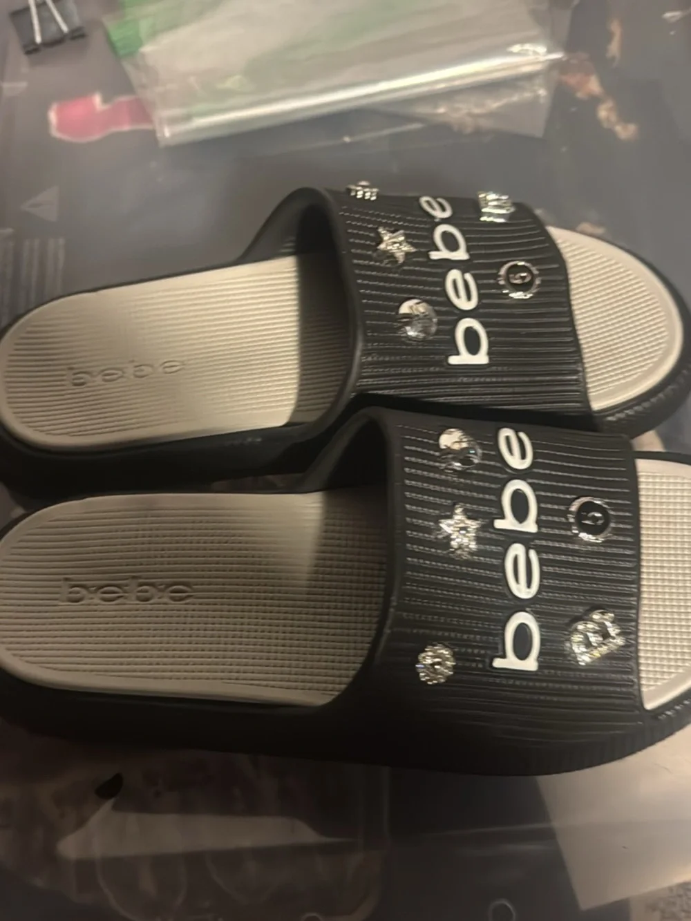 bebe Black and Cream Slide Sandals with Silver Stud Accents